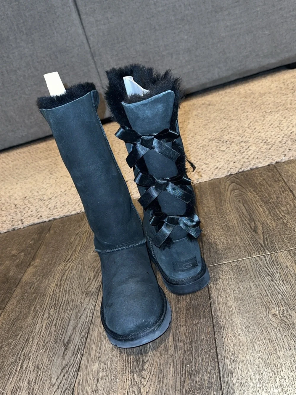 UGG Black Tall Shearling Boots with Bow-Back Ribbon Detail